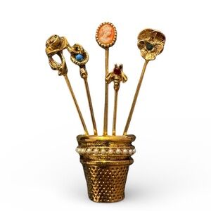 Vintage gold-plated thimble brooch with five stick pins.